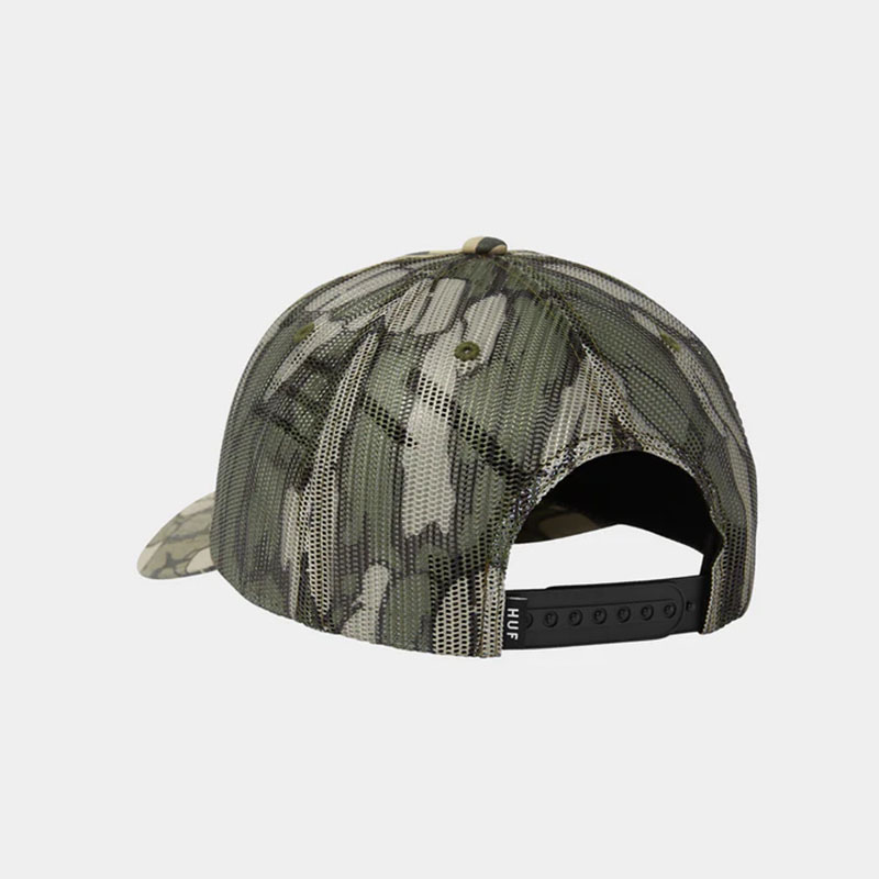 HUF(ハフ)/ WARPED CAMO TRUCKER HAT -CAMO-